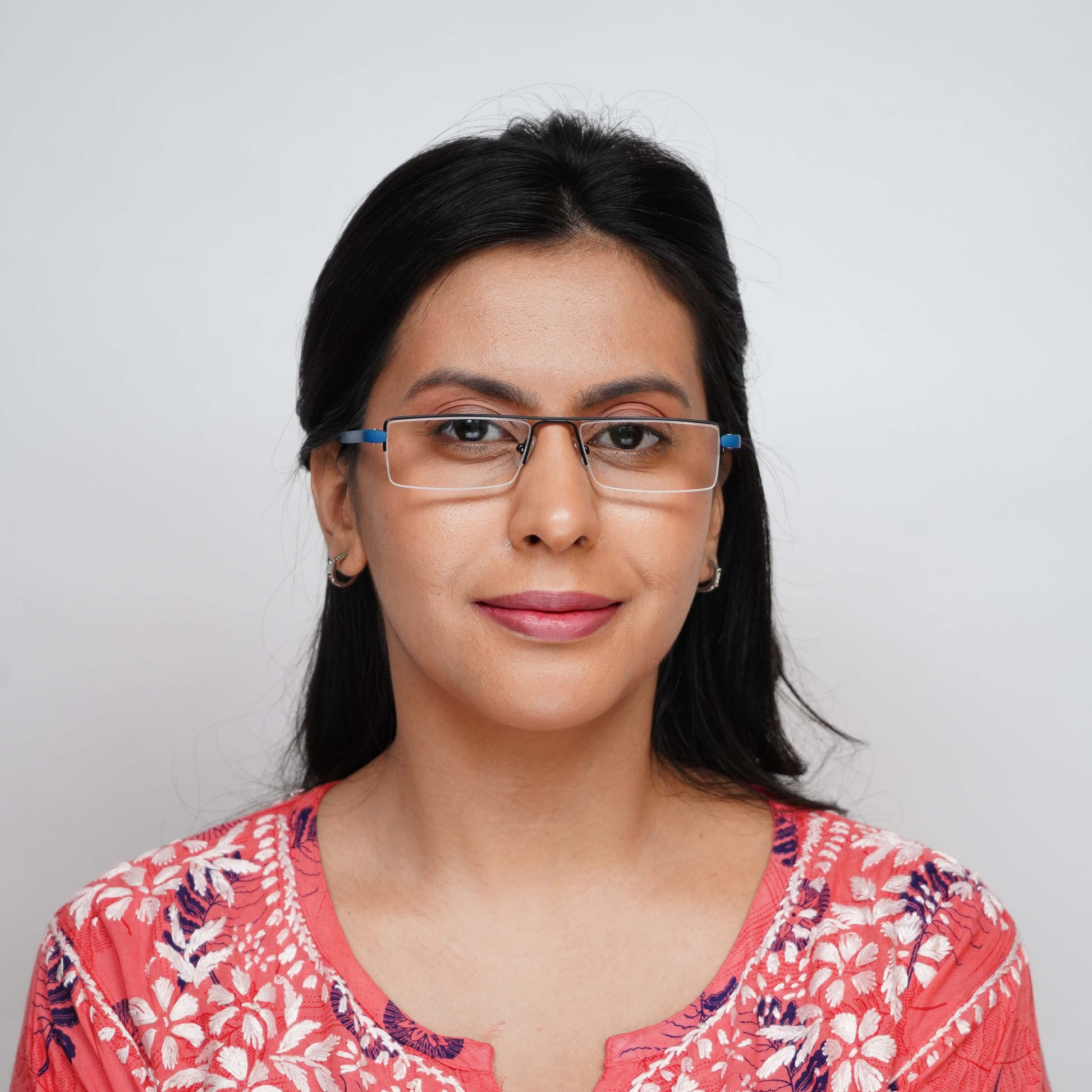 Woman wearing Pagina blue half-rim reading glasses