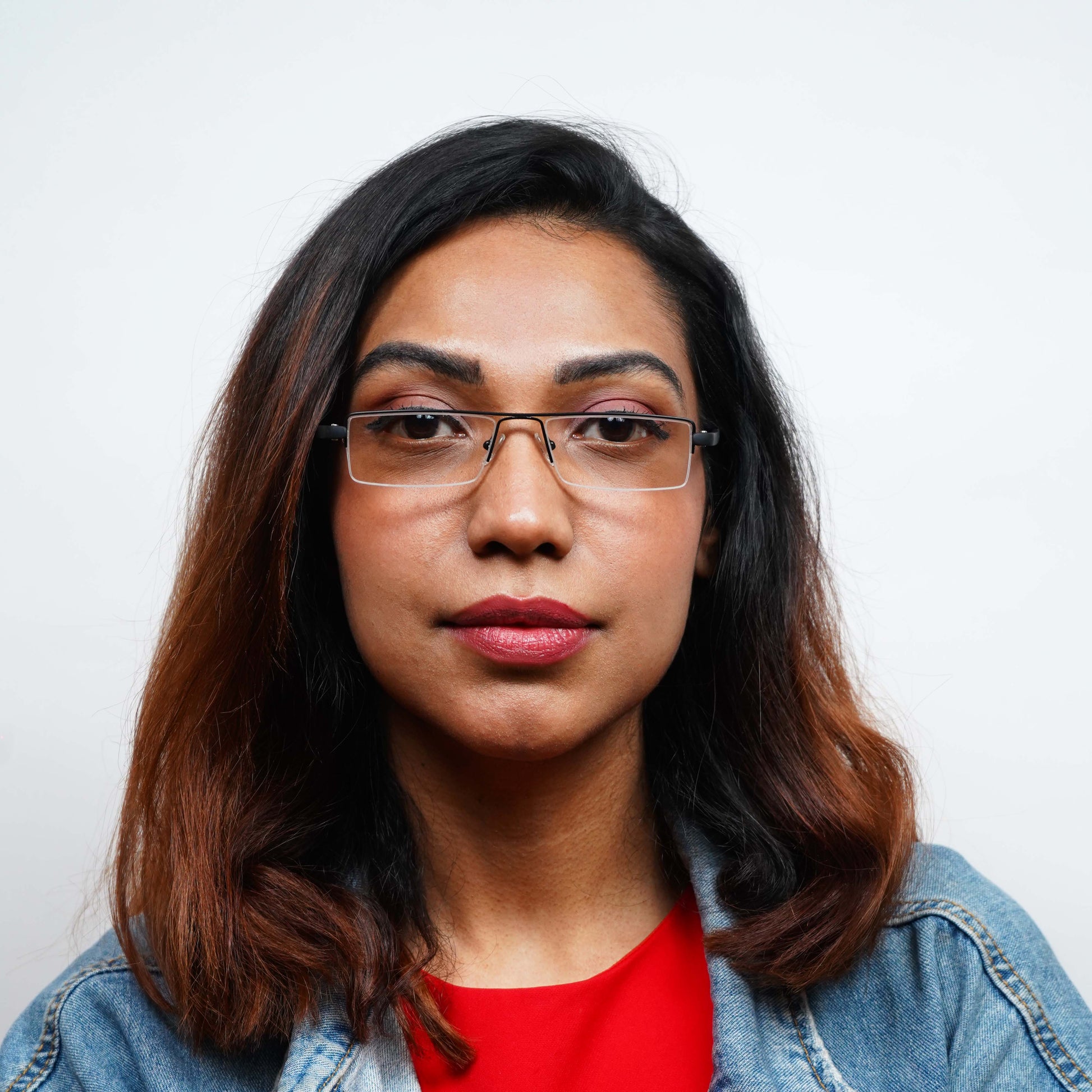 Woman wearing Pagina black half-rim reading glasses
