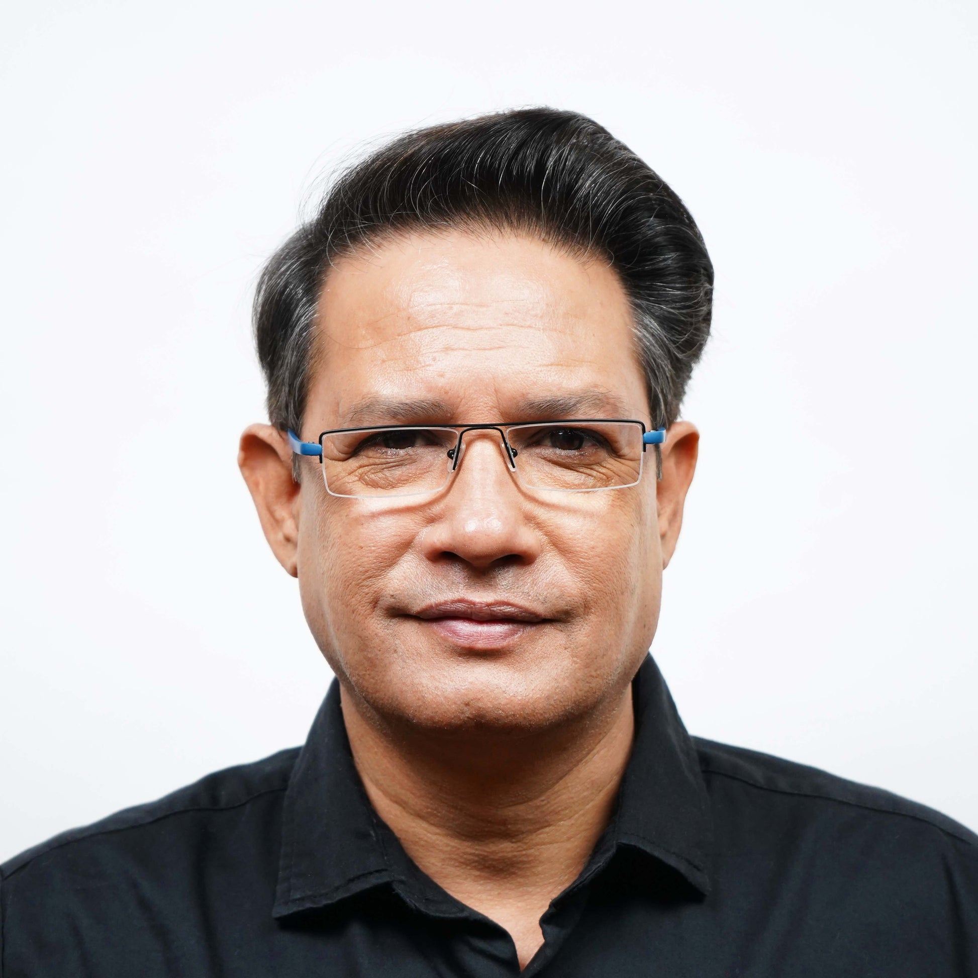 Man wearing Pagina blue half-rim reading glasses