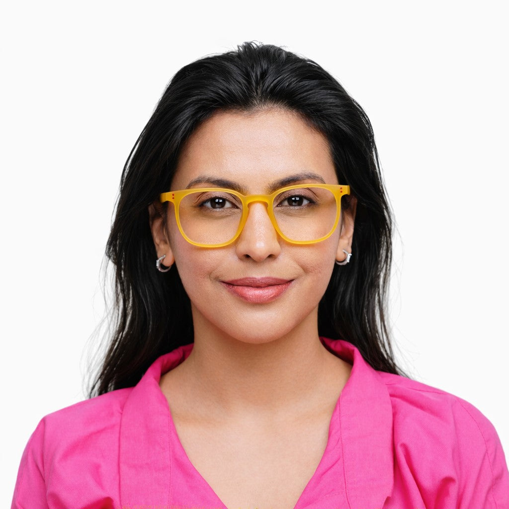 Woman wearing Pixo reading glasses in yellow.
