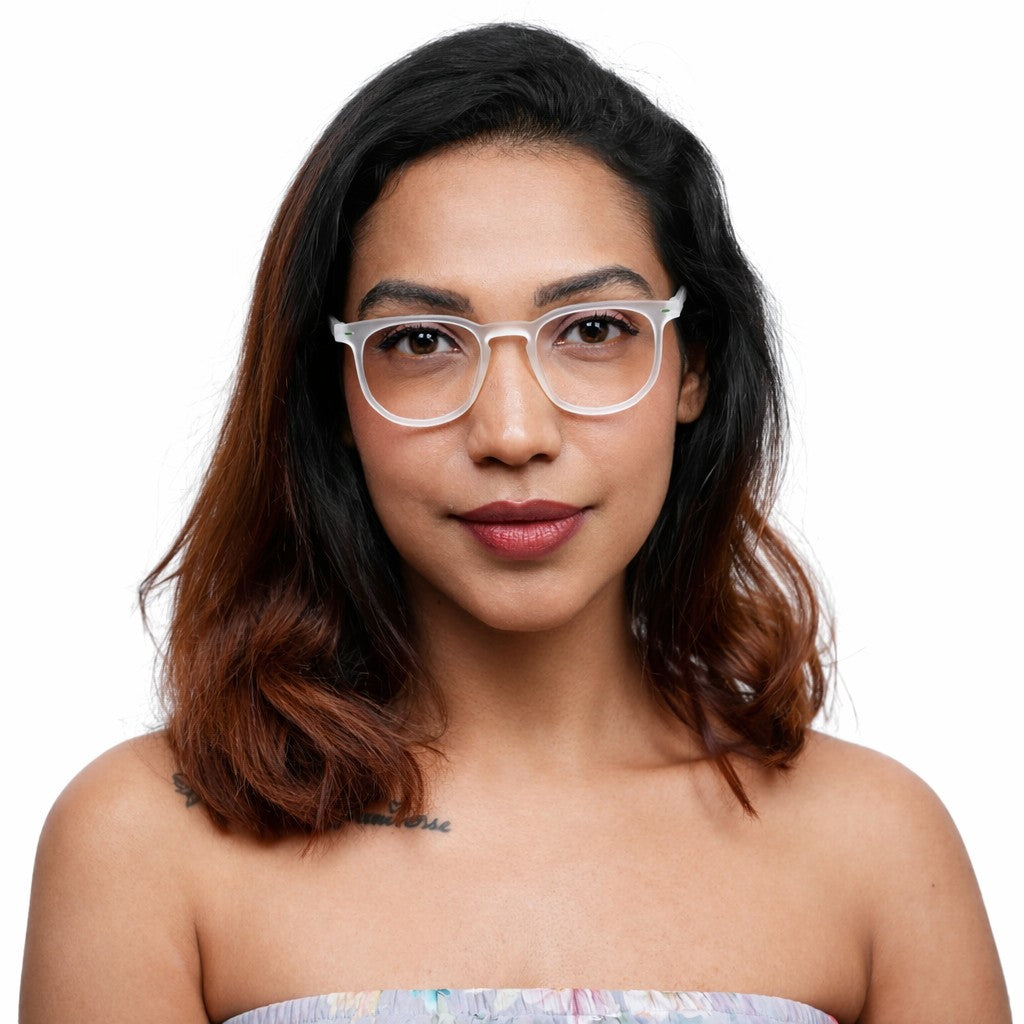 Woman wearing translucent white Wayfer reading glasses